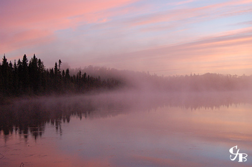 Photo: Sunrise on a trout lake in northern Minnesota. Photo by Chris J. Benson