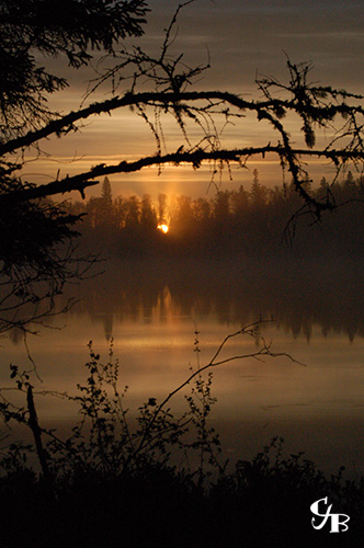 Photo: Sunrise on a trout lake in northern Minnesota. Photo by Chris J. Benson